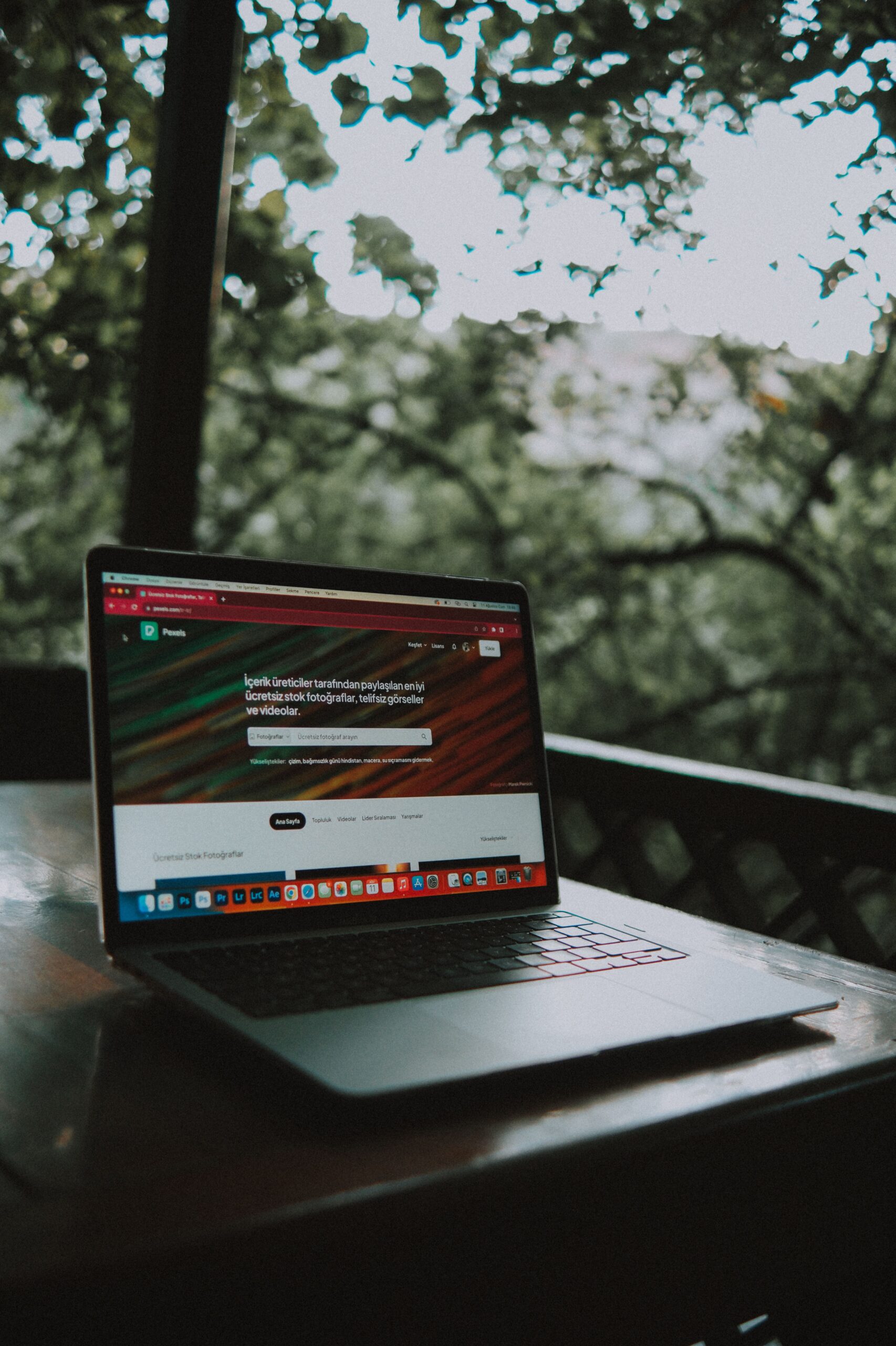 Laptop displaying an outdated business website on a wooden table